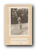 041 - JJ Reider Playing Tennis in Uniform with a Pipe.jpg